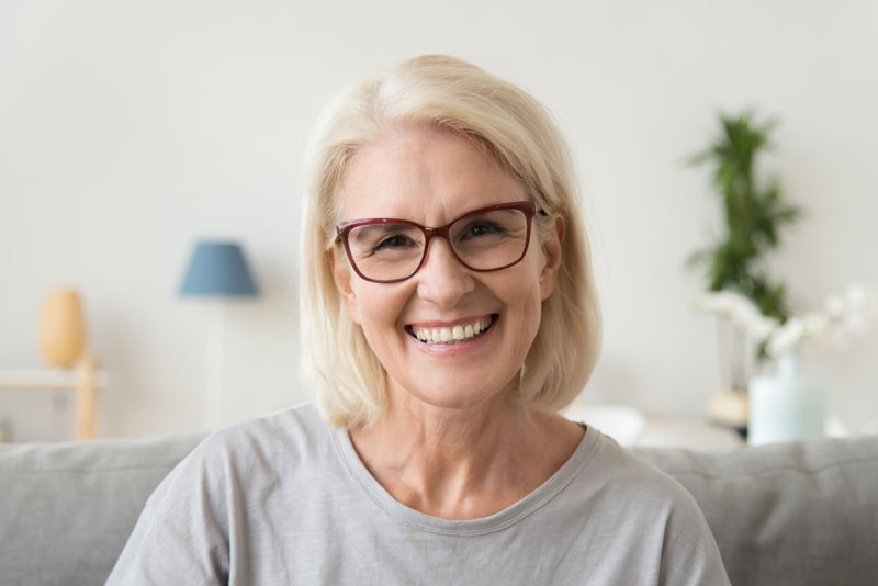 Dental Patient Smiling After Getting Dental Implants In New London, CT