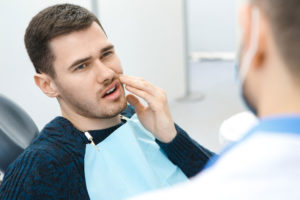 Dental Patient Suffering From Mouth Pain On A Dental Chair, In New London, CT