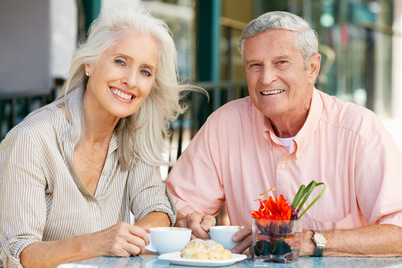 Dental Implant Patients Eating Together With Their False Teeth in New London, CT